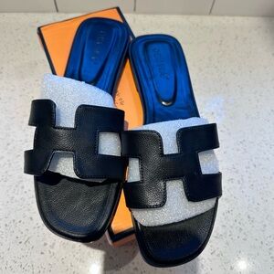 Women’s black sandals, new.